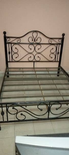 iron bed 6 * 6 used good condition for sale. Single bed wooden. 8