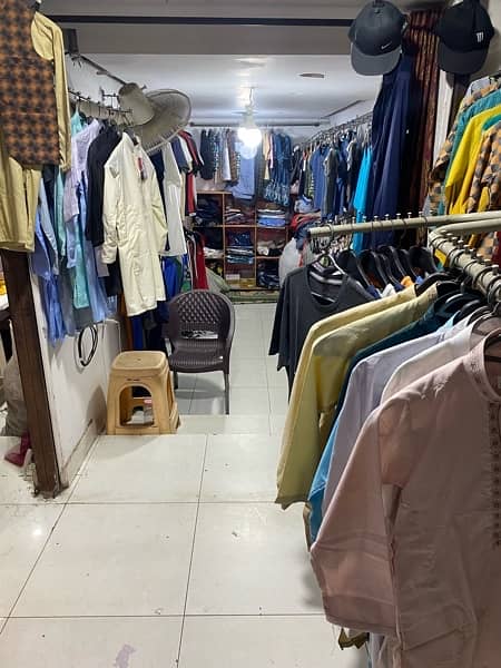 In running front location Garment shop for sale with stock 6