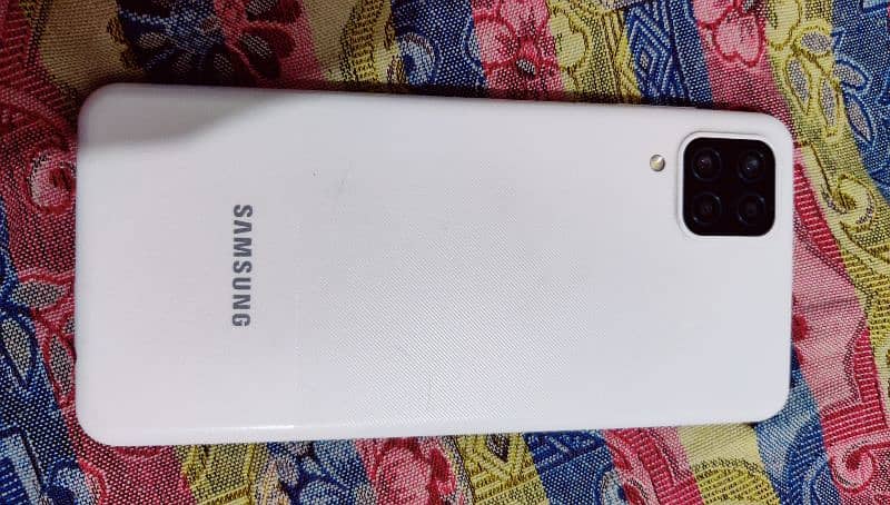 model name galaxy A12  ram 4/64 condition 10/10 and with box 3