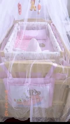 Baby cot with swing.