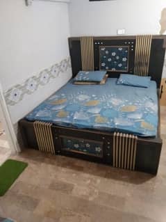 King size double bed with spring mattress