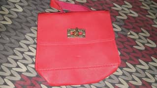 New Imported bags red in colour with multidesign ribbon and gold chain