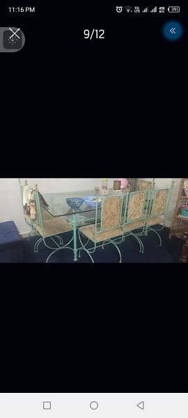 iron dining table is good condition 6 chair full size 7