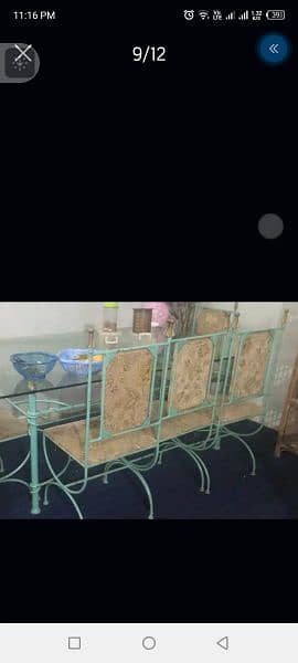 iron dining table is good condition 6 chair full size 9
