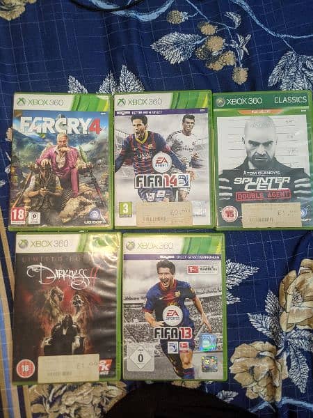 Xbox 360 e (500 gb) with 2 wireless controller and 5 dvd 1