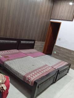 2 single beautiful wooden beds