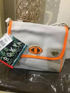 original Roxy brand handbag worth over 30$ brand new with tags untouch