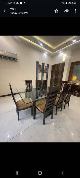 8 seater dining table, 
Solid sheeshm wood 
With glass top 1