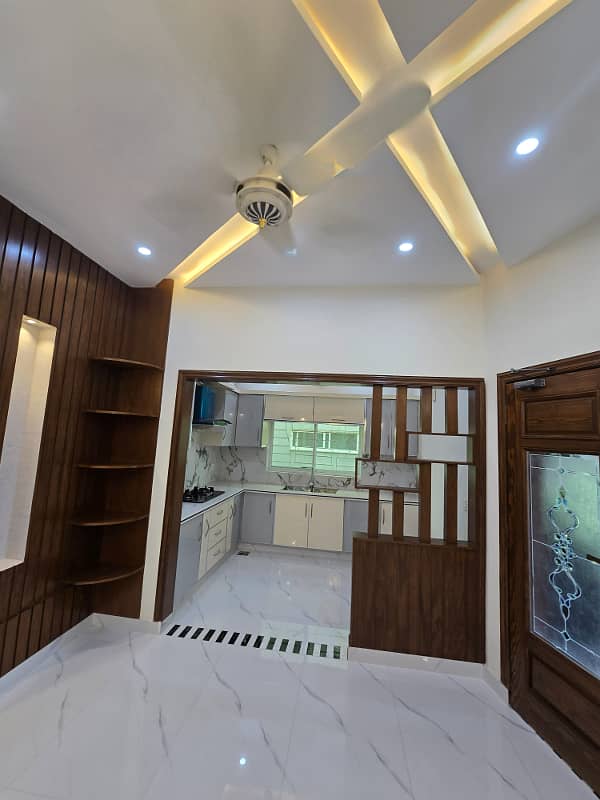 10 marla brand new modern house available for rent in sector F Talha block bahria town lahore 1