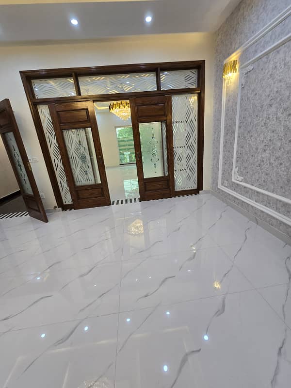 10 marla brand new modern house available for rent in sector F Talha block bahria town lahore 8