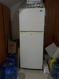fridge is old but in working condition, large size