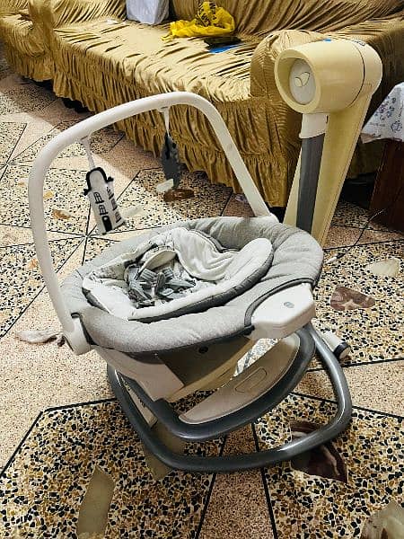 branded swing for babies. And twin pram for babies 5