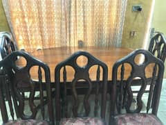 wooden dinning table with five chairs
