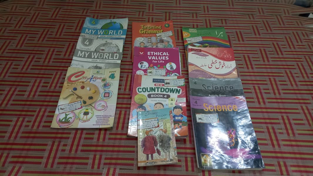School books of class UKG , 1 , 2 and class 4 3