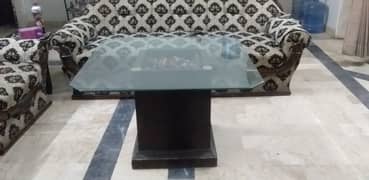 Centre Glass table with wooden base 0