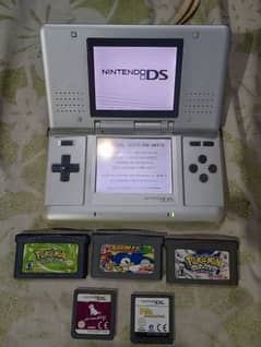 NINTENDO DS WITH 3 GAMEBOY OR 2 DS CASSETS ALL OK GOOD CONDITION