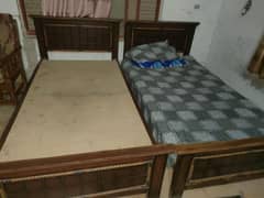 2 single wood beds in good condition