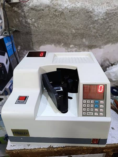 Cash currency Packet note counting machine in Pakistan,Mix value count 15