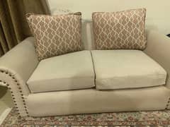 2 seater sofa in nude with cushions slightly used