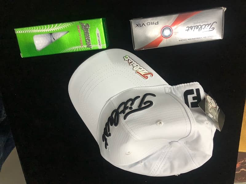 Titleist cap, Pro V1x golf balls, Srixon soft tour golf balls 3