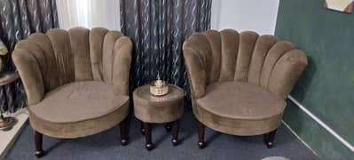 2 Sofa chairs with a Table.