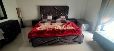double bed ,side tables,and dressing table