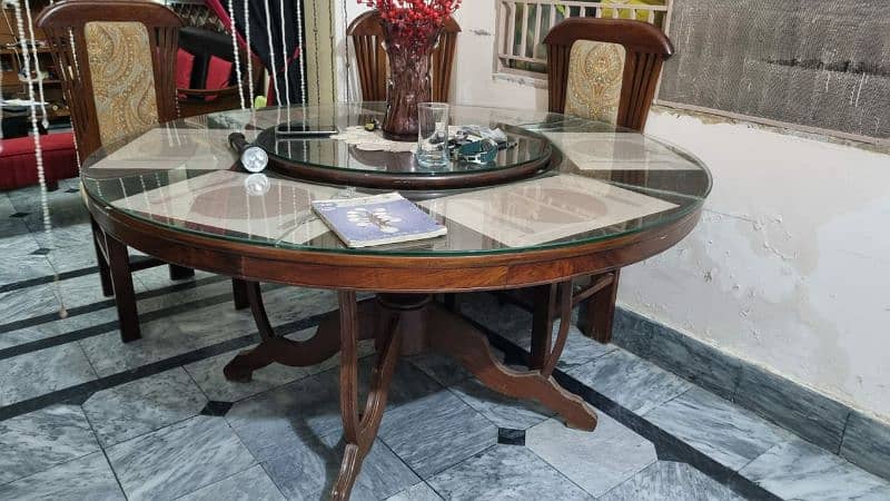 Round wooden dining table with movable top and thick glass 1