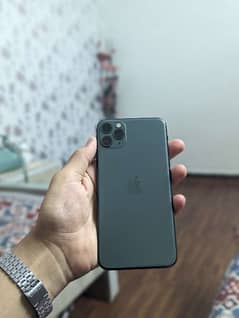 iPhone 11 pro max with 2 covers and a charger free