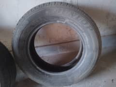 toyota corolla 5 tyres and 2 mehran tyres