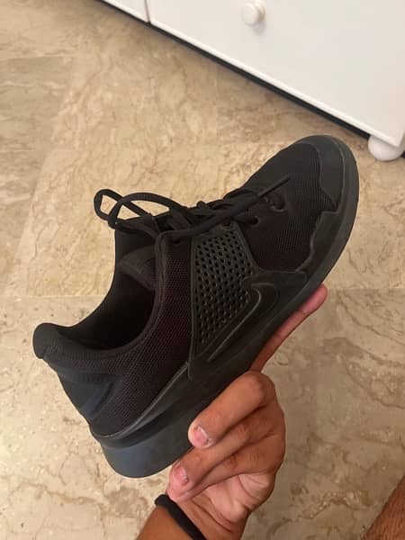 slightly used Nike training shoes 1