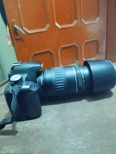 canon 500d with 90/300 lens with box charger 1