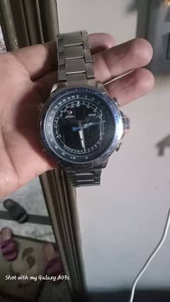 shark sports aviation watch with blue nos dial with shark logo inside.