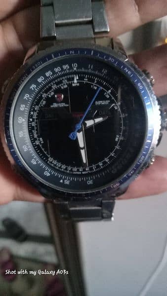 shark sports aviation watch with blue nos dial with shark logo inside. 4