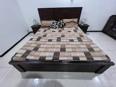 king size bed with side tables and mattress