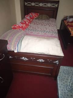single bed with side table