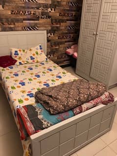 single big size bed with matress with cupboard