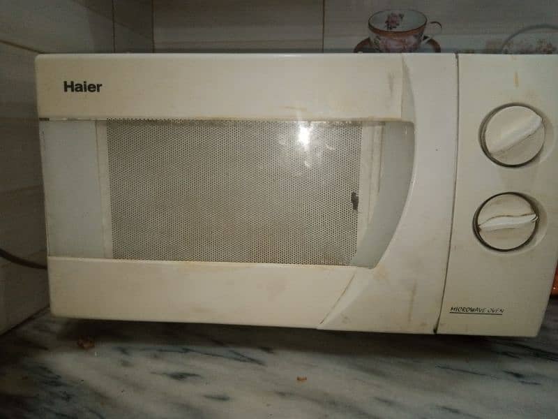 Haier microwave oven.  HR- 5702D. 0