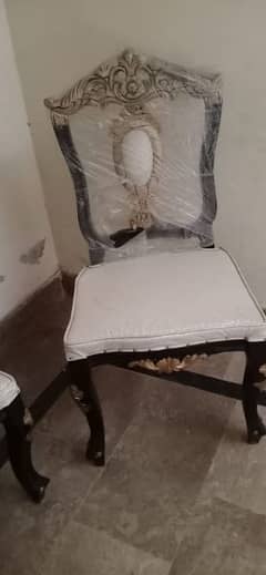 6 chairs and dining table condition 10 by 10