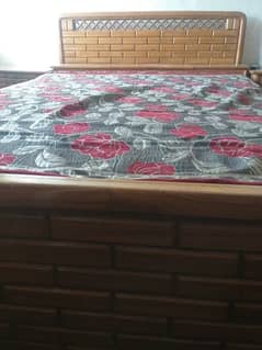 double bed with mattress and 2 side tables