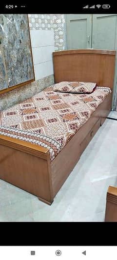 single bed with mattress side table
