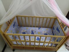Baby Cot Wooden with swing and organiser. (price negotiable)