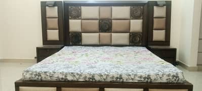 king size bed with side table and Dressing table
