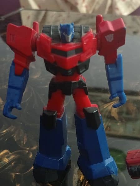 Preloved Transformers Optimus Prime figurines. 2