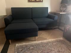 Navy blue sofa with foot rest