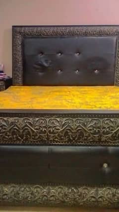 Queen size bed with 2 drawers and wall hanging mirror. 0