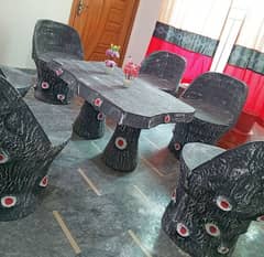 Stone table and chair set is available for sale