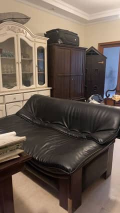 Black leather sofa. 0