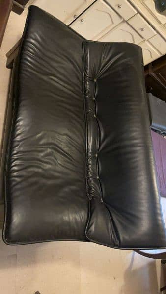 Black leather sofa. 1