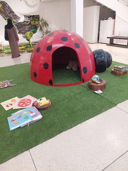 Wooden Ladybug House for kids with grass carpet 1