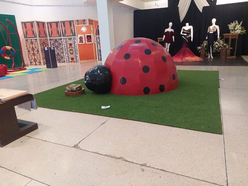 Wooden Ladybug House for kids with grass carpet 2